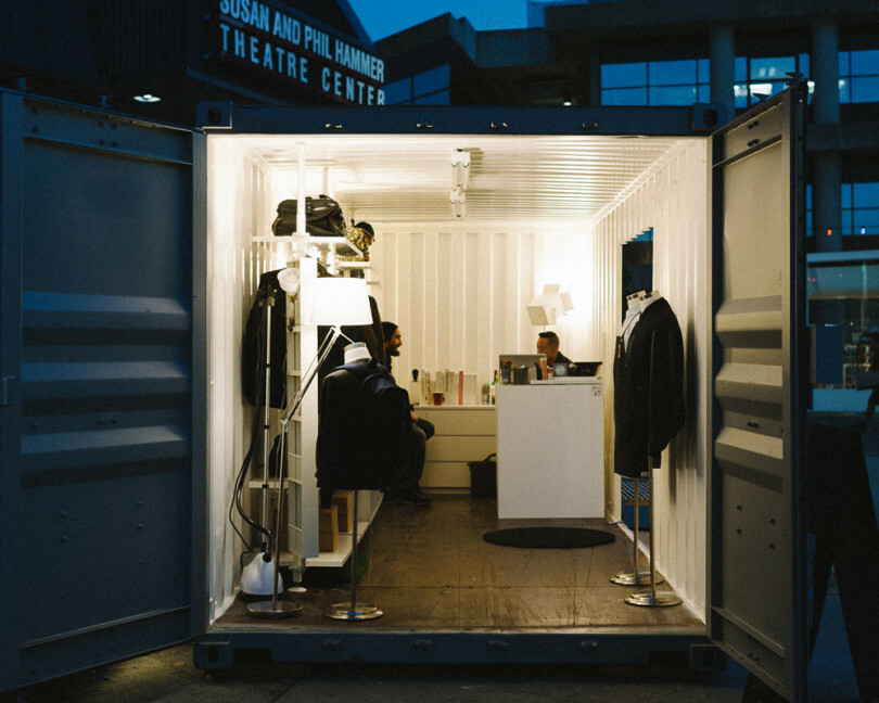 Container pop-up shop open at night Shipping container pop-up shop open for business and lit up at night
