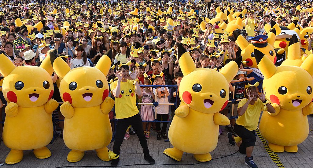 Dozens of people dressed up as Pikachu, the famous character of Nintendo's videogame software Pokemon, dance with fans as the final of a nine-day "Pikachu Outbreak" event takes place to attract summer vacationers in Yokohama, in suburban Tokyo, on August 16, 2015. AFP PHOTO / Toru YAMANAKA (Photo credit should read TORU YAMANAKA/AFP/Getty Images)