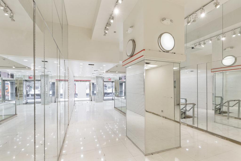 Flexible boutique space in Upper East Side Lennox Hill with mirrored walls and white interior