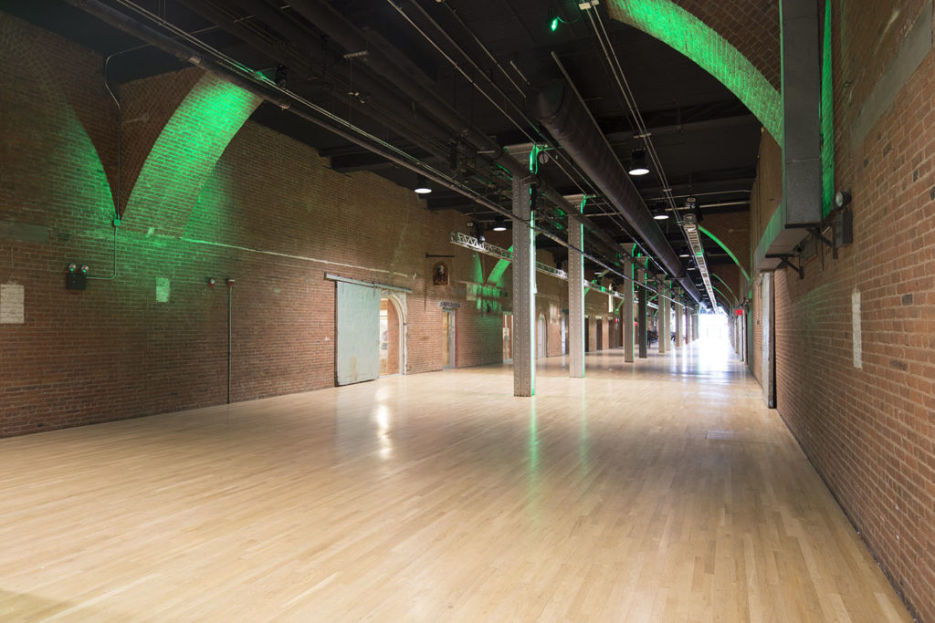 Spacious event space on the Hudson in Chelsea with exposed brick walls and industrial interior