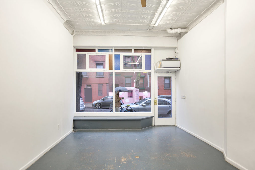 Pop-up shop interior in Nolita empty space looking out onto busy street