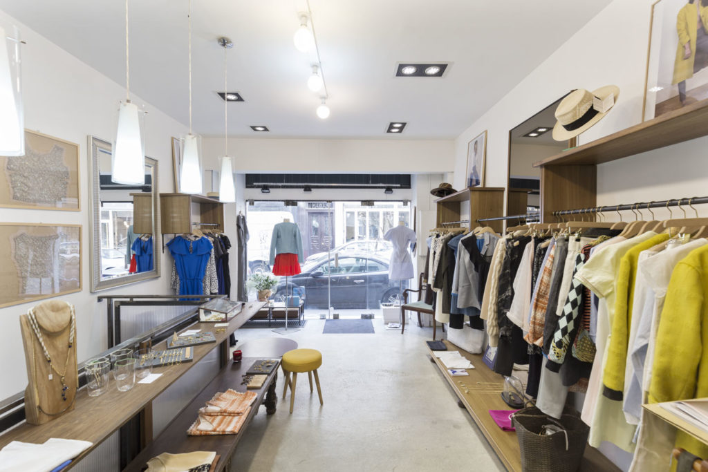 Fully stocked pop-up shop interior in Le Marais with merchandise displays and customer-ready layout