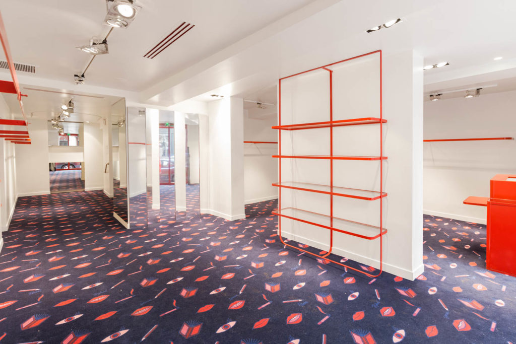 Le Marais unique pop-up store interior with curated retail layout and high-end fashion surroundings