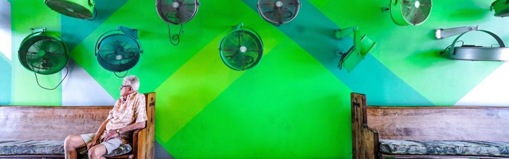 Bright green stylized street scene in Little Haiti, one of the emerging Art Basel Miami neighborhoods