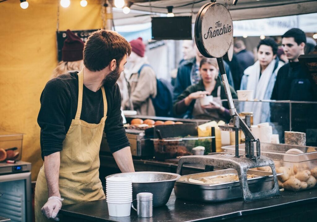 Chef preparing dishes in a pop up restaurant kitchen