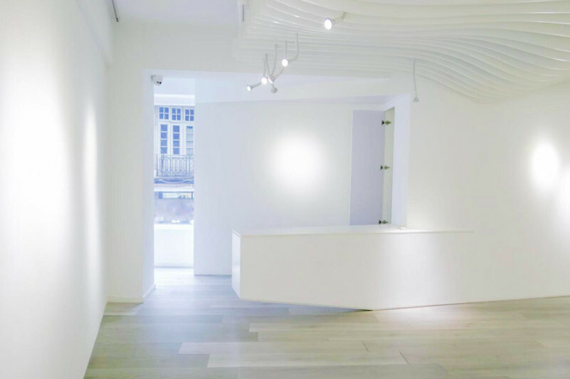 A bright, white-lit showroom interior available for an Art Basel Miami brand activation