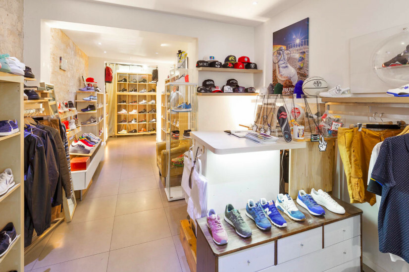 Interior of a shoe pop up shop in Pigalle with product displays